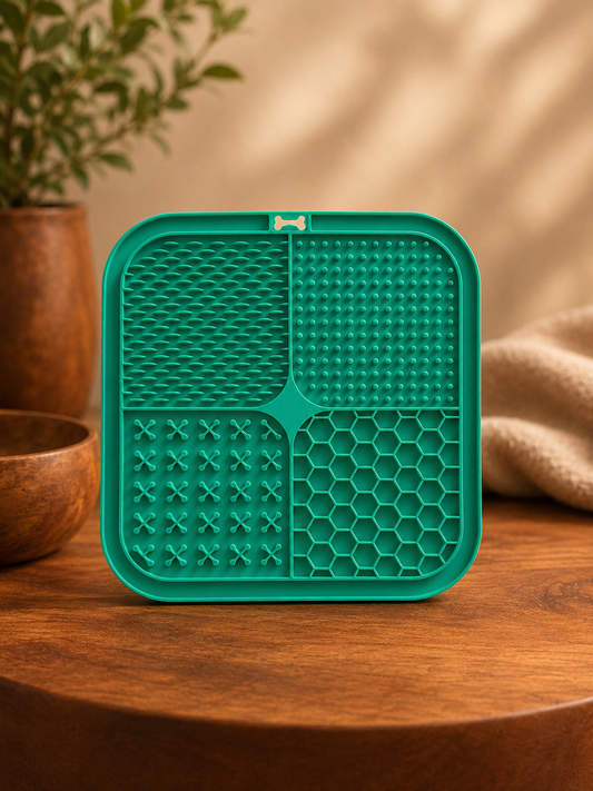 Green silicone mat with textured design on a wooden surface
